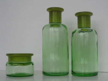 Il verde ha colorato il vetro dell'olio essenziale imbottiglia 200ML 150ML 50G con il riduttore & il cappuccio dell'orifizio
